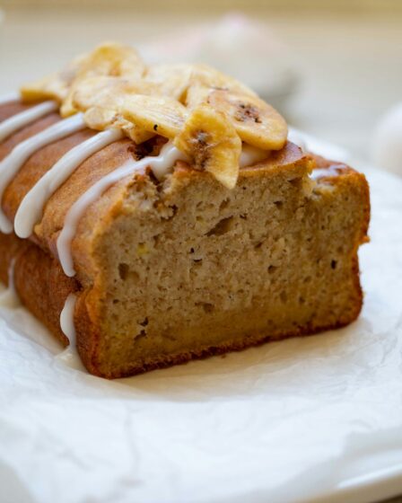 a loaf of banana bread sitting on top of a white napkin